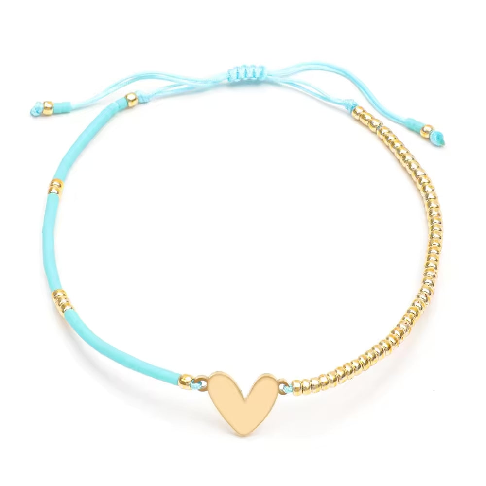 Pulsera Corazon de Hilo dorada