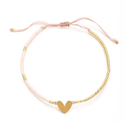 Pulsera Corazon de Hilo dorada